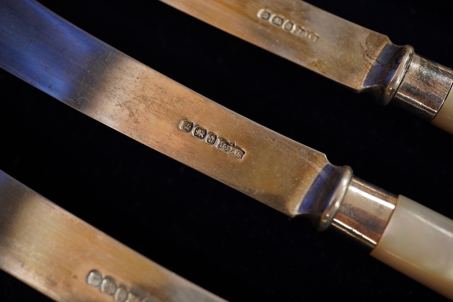 A cased set of six pairs of late Victorian mother of pearl pistol handled silver dessert eaters, by James Dixon & Sons, Sheffield, 1896, knife 20.3cm. Condition - fair to good